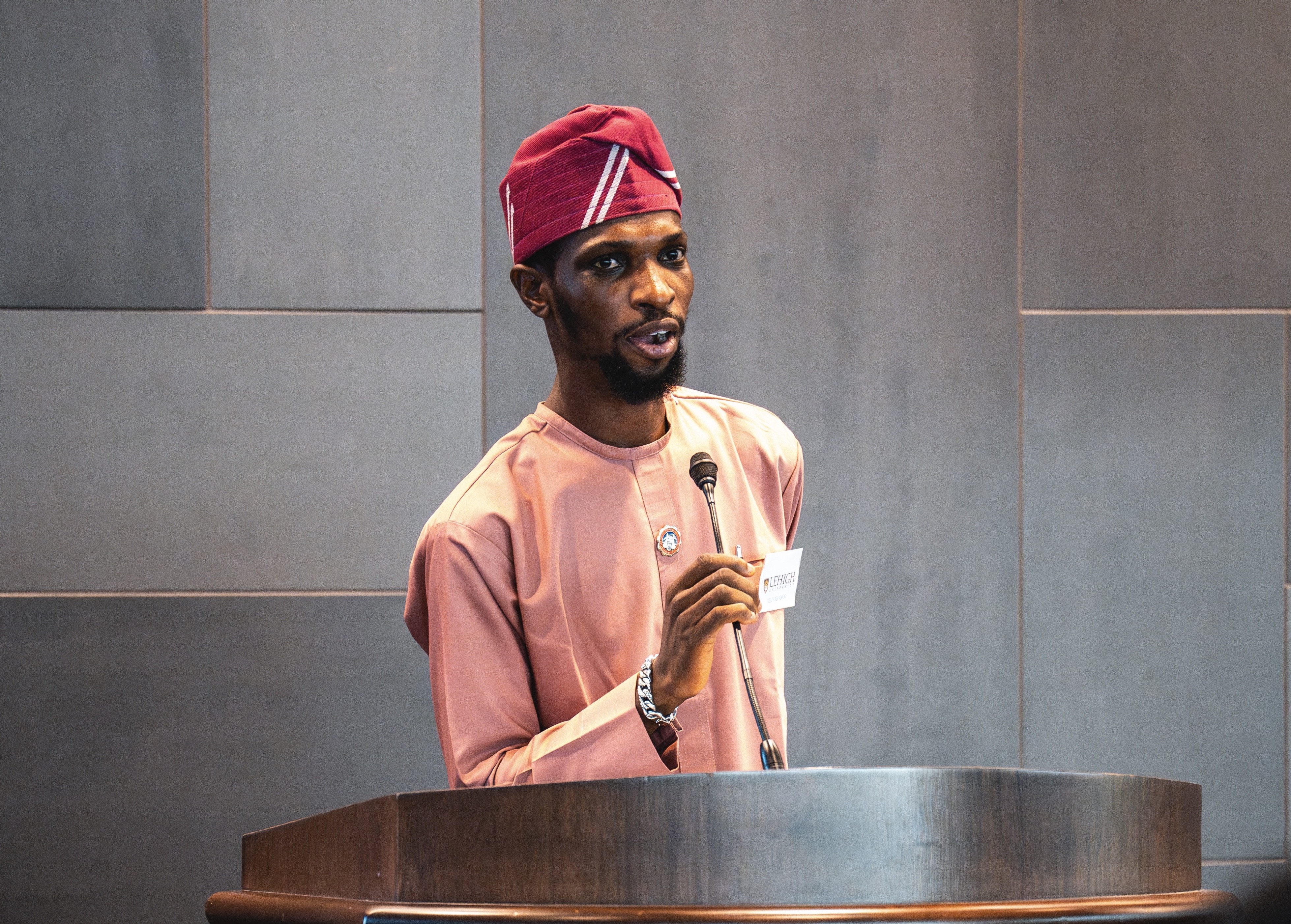 Amoo Ridwanullahi Olasunkanmi speaking at a podium