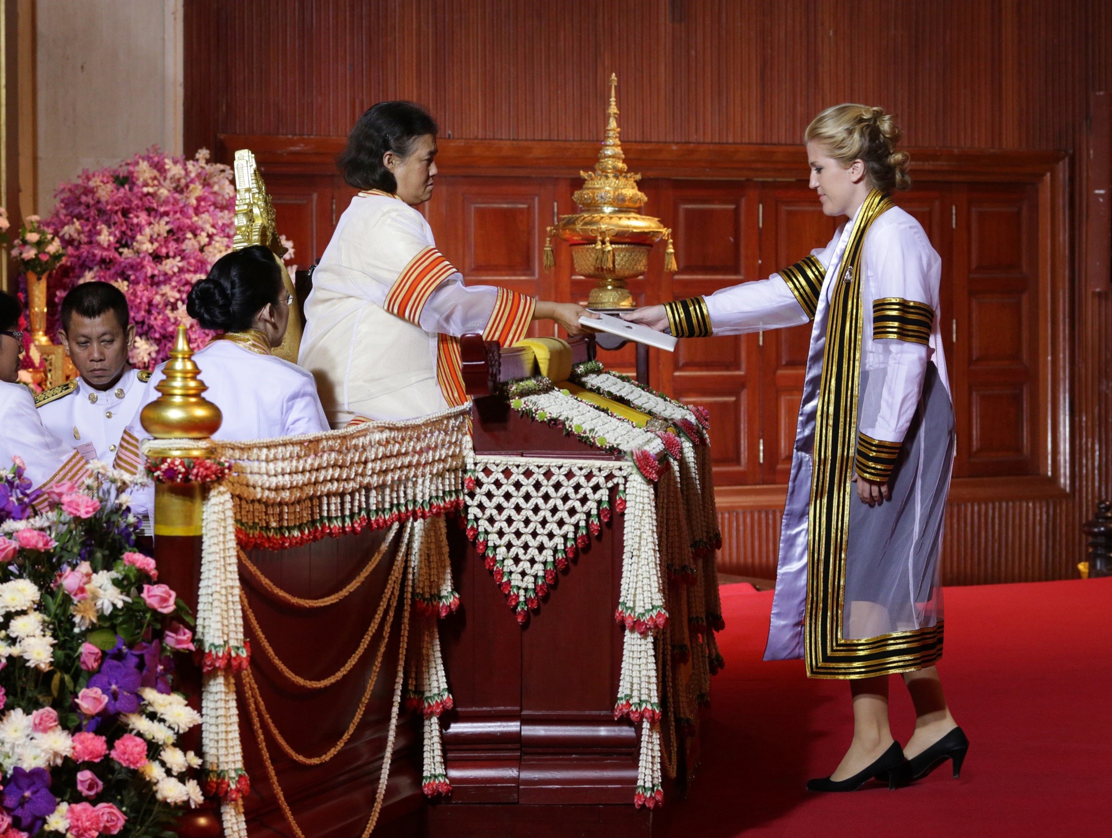 Ashley Pritchard receiving a diploma in Thailand