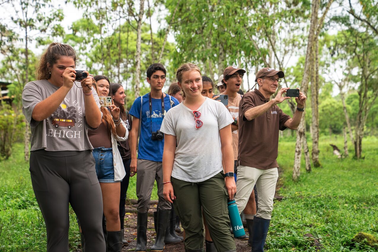 A group of students looking off camera in Ecuador