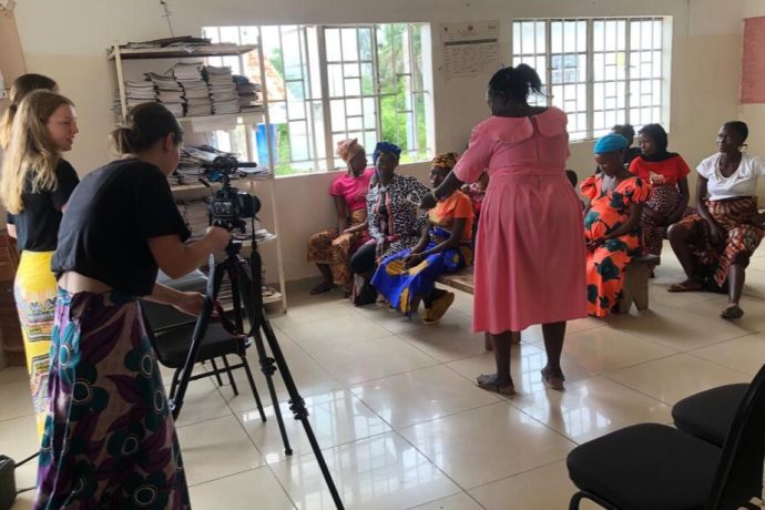 Students filming people in a Sierra Leone hospital