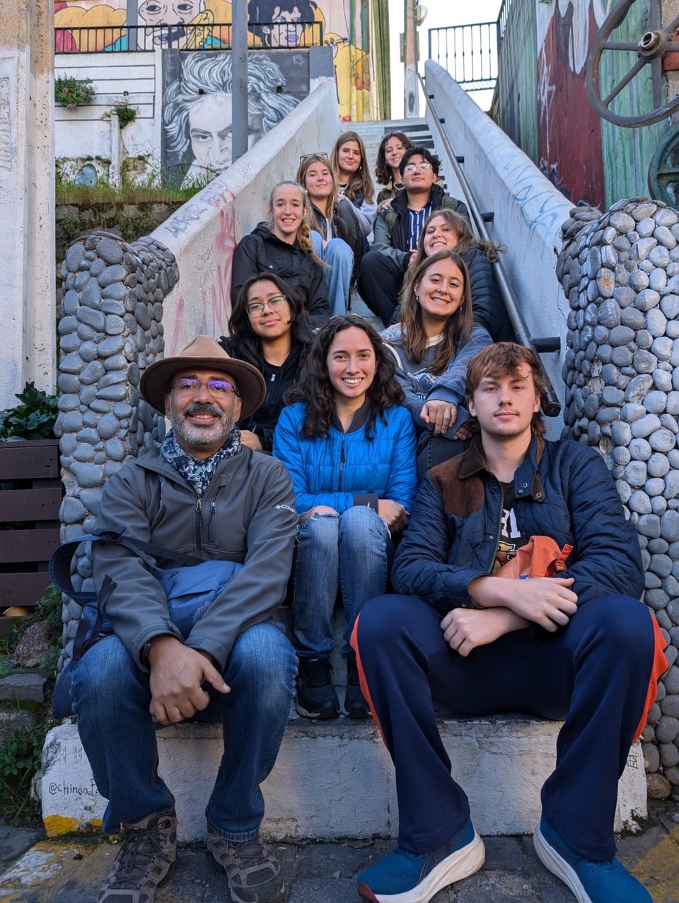 Lehigh students sitting on a staircase outside in Chile