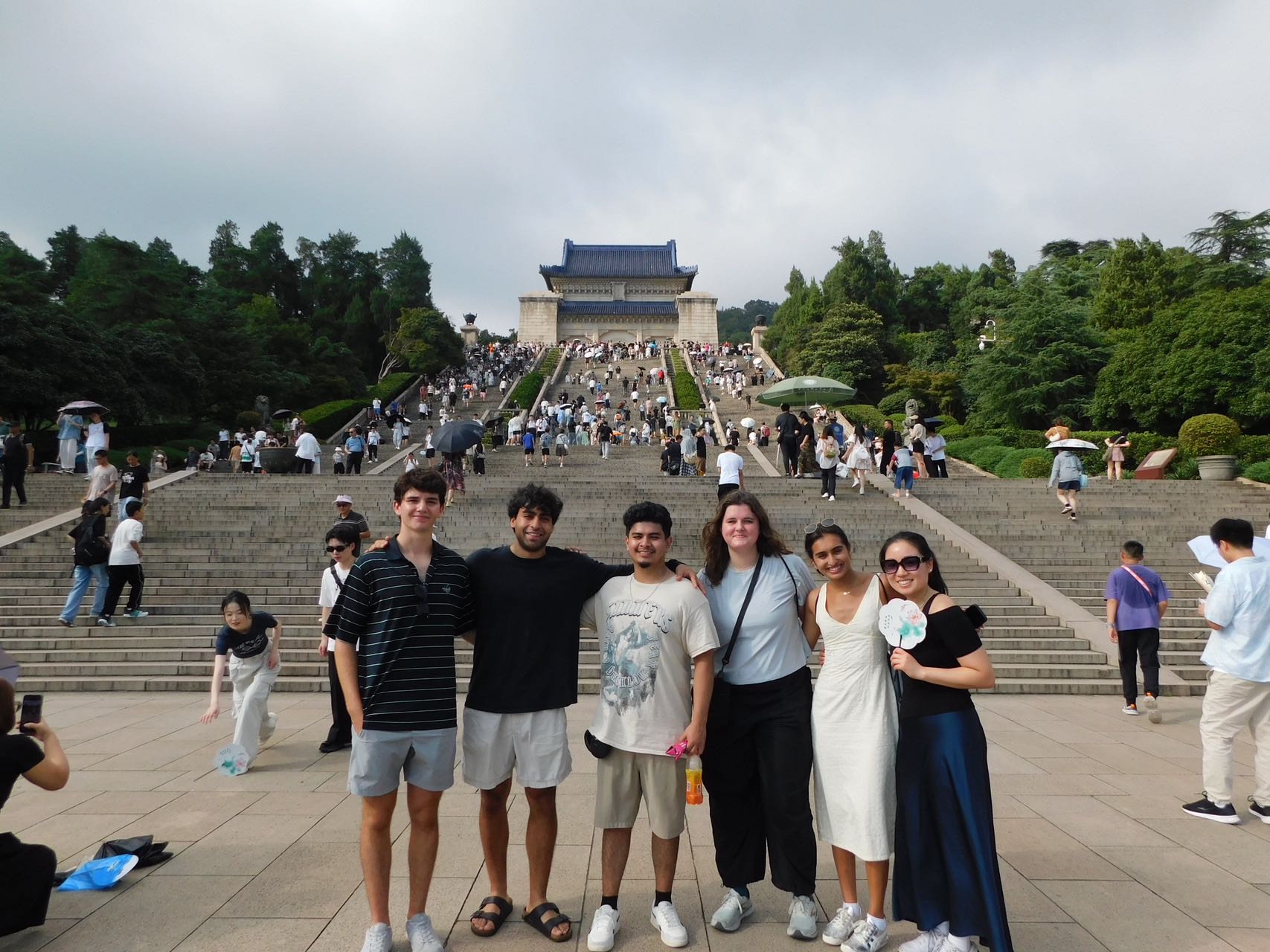 A group of people posing for a photo in Shanghai