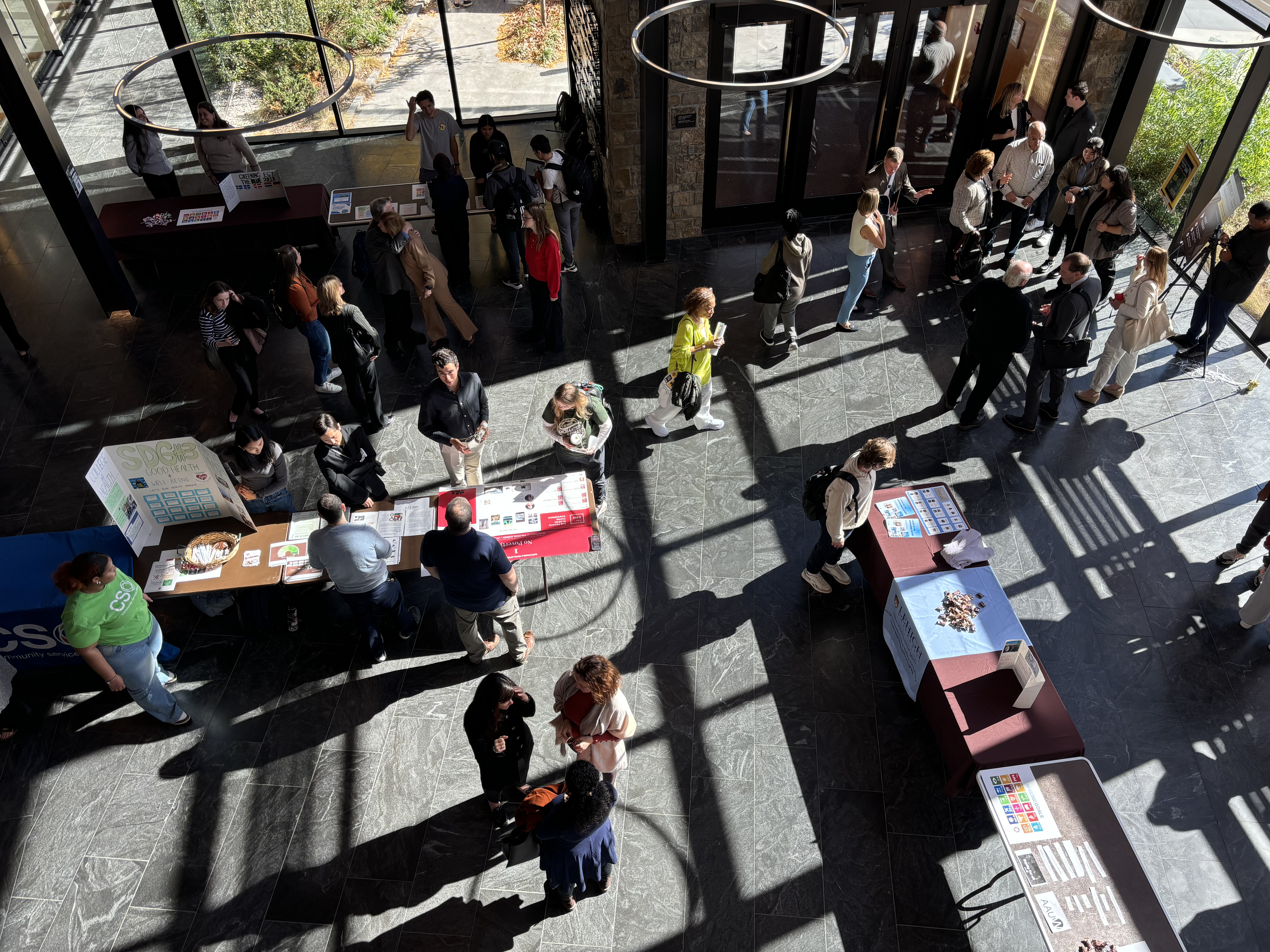 A large gathering of people at an indoor fair