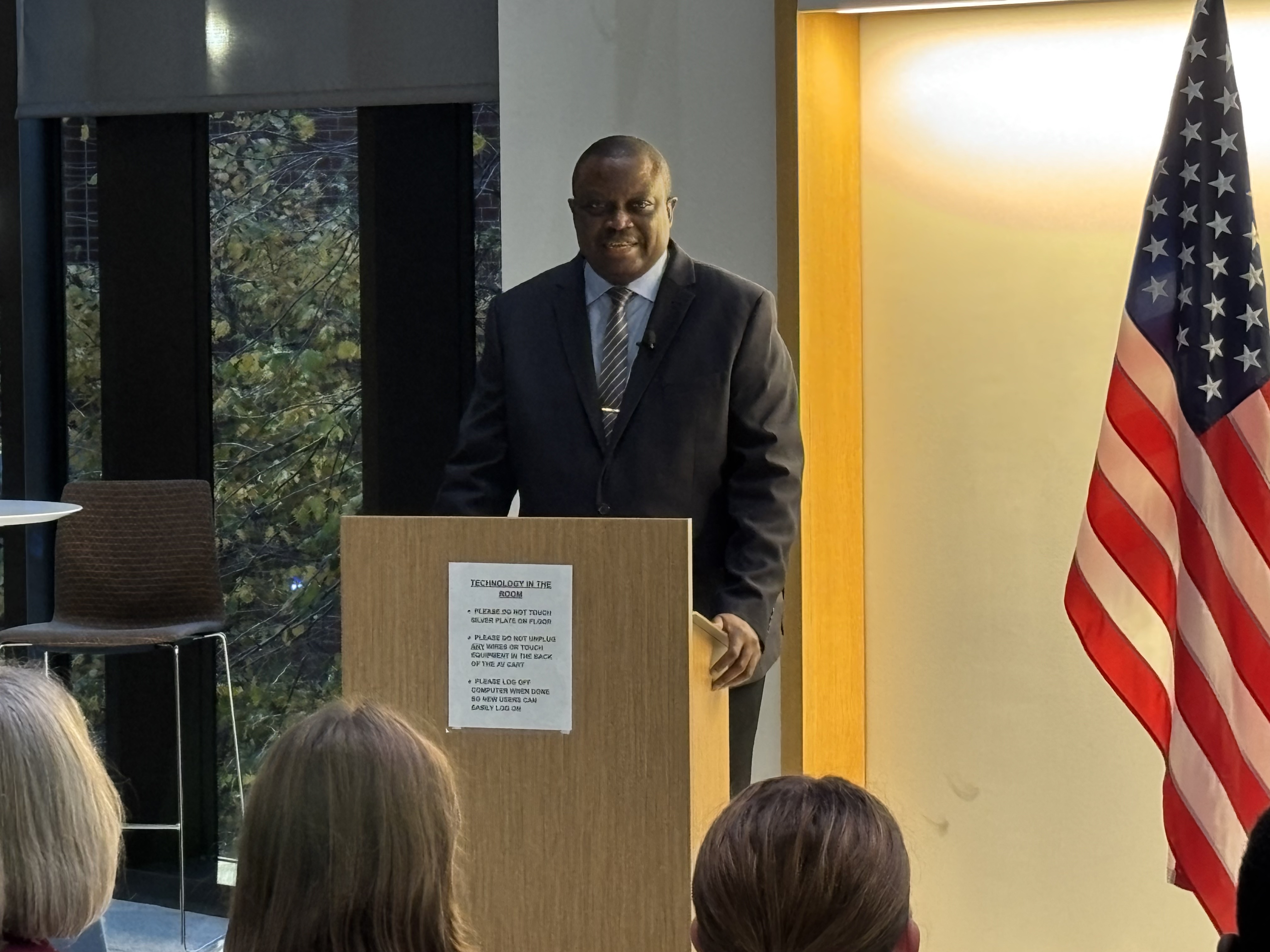 A man speaking at a podium