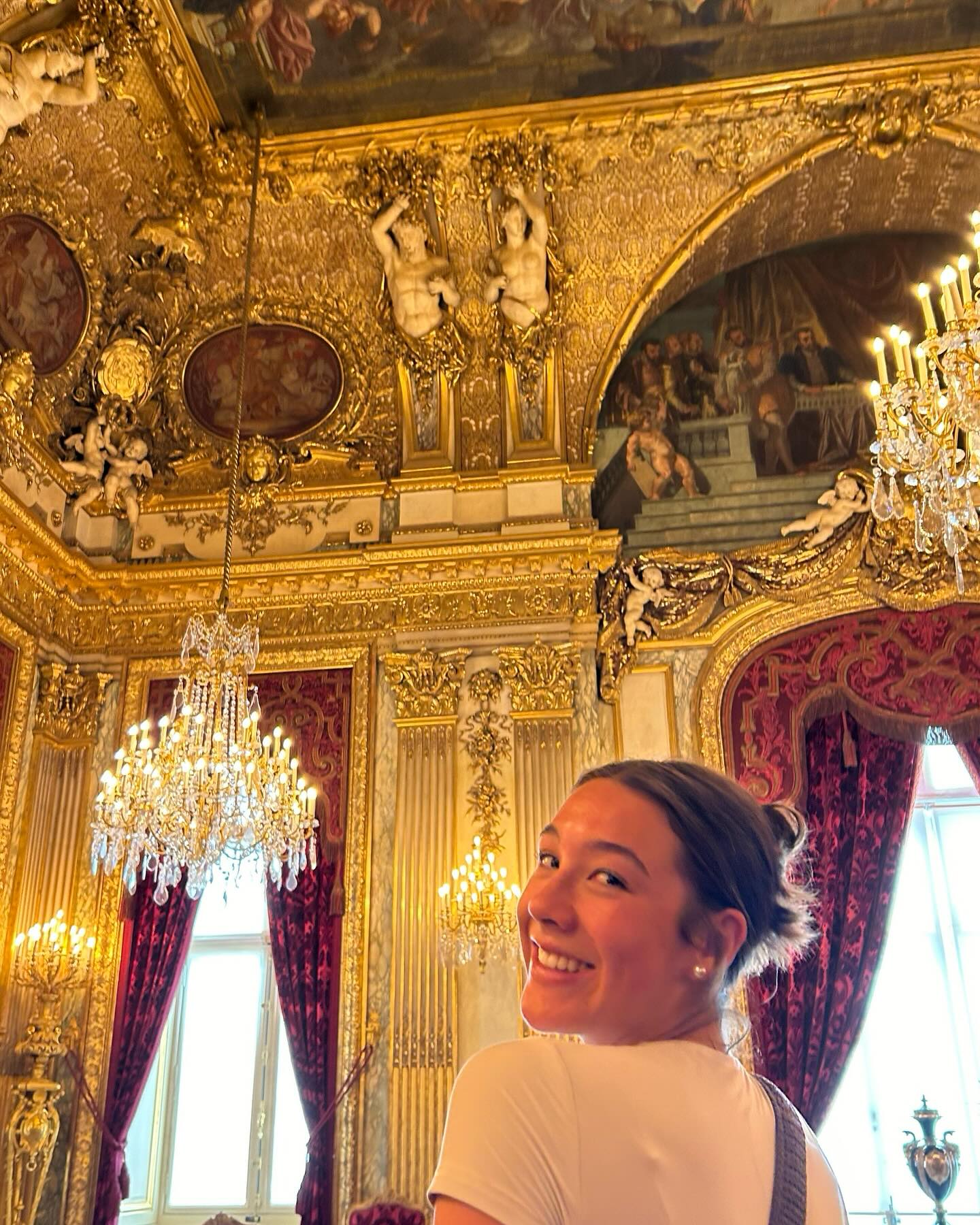 A college student in the Napoleon III Apartments in the Louvre Museum