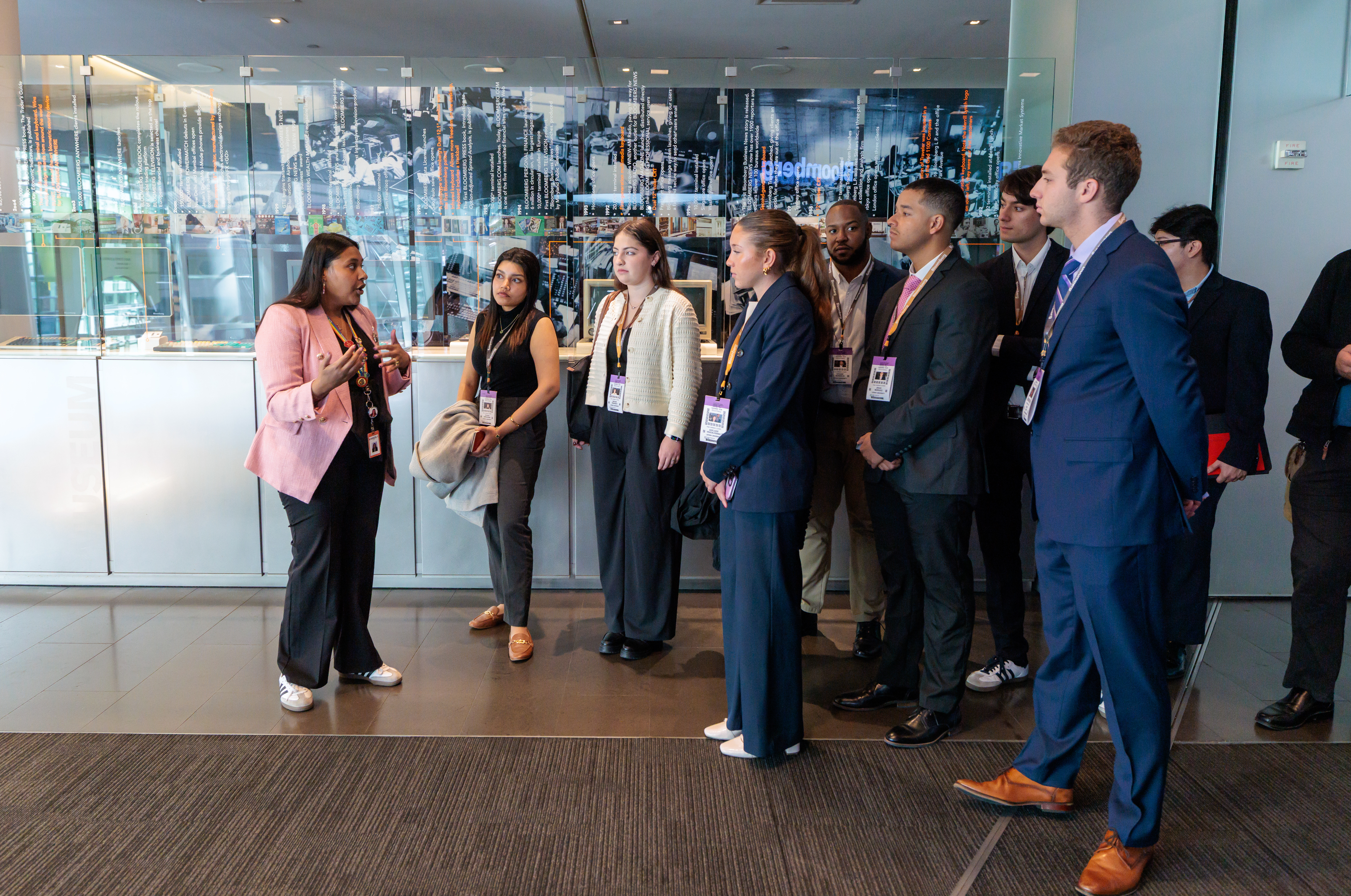 A guide talks to several students at Bloomberg Tower
