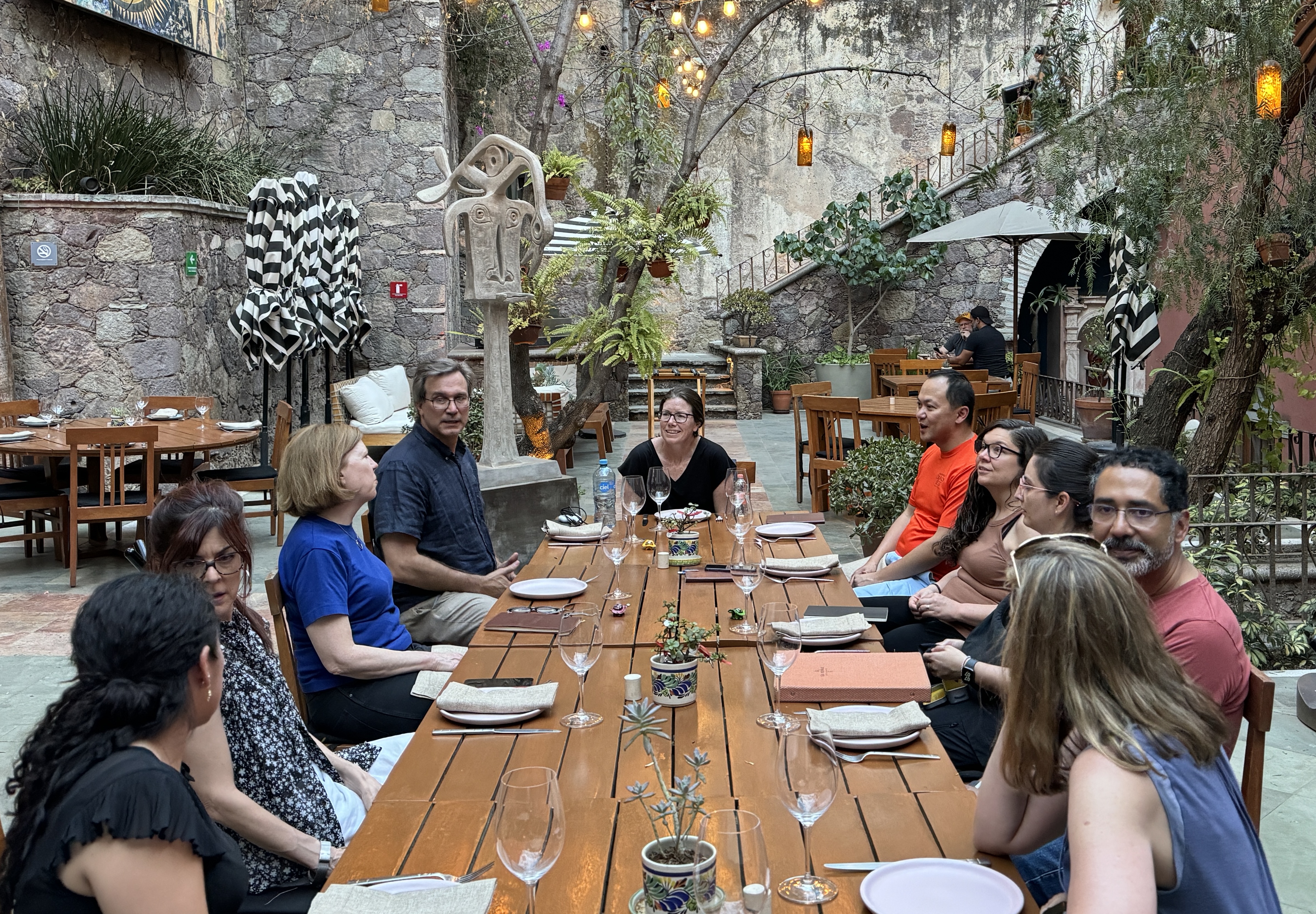 A group of people sitting at a dinner table in Guanajuato, Mexico.