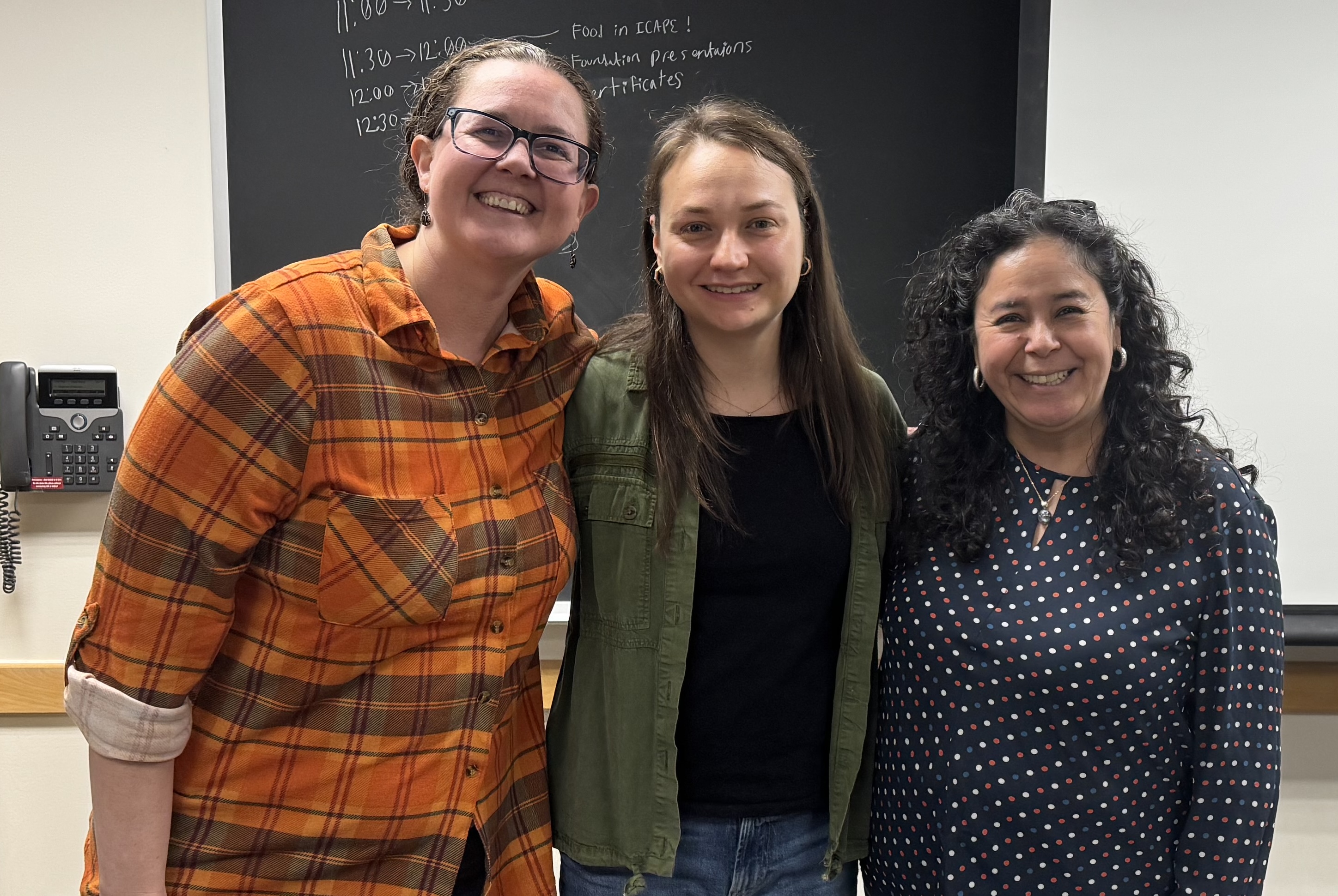 Three women posing together for a photo