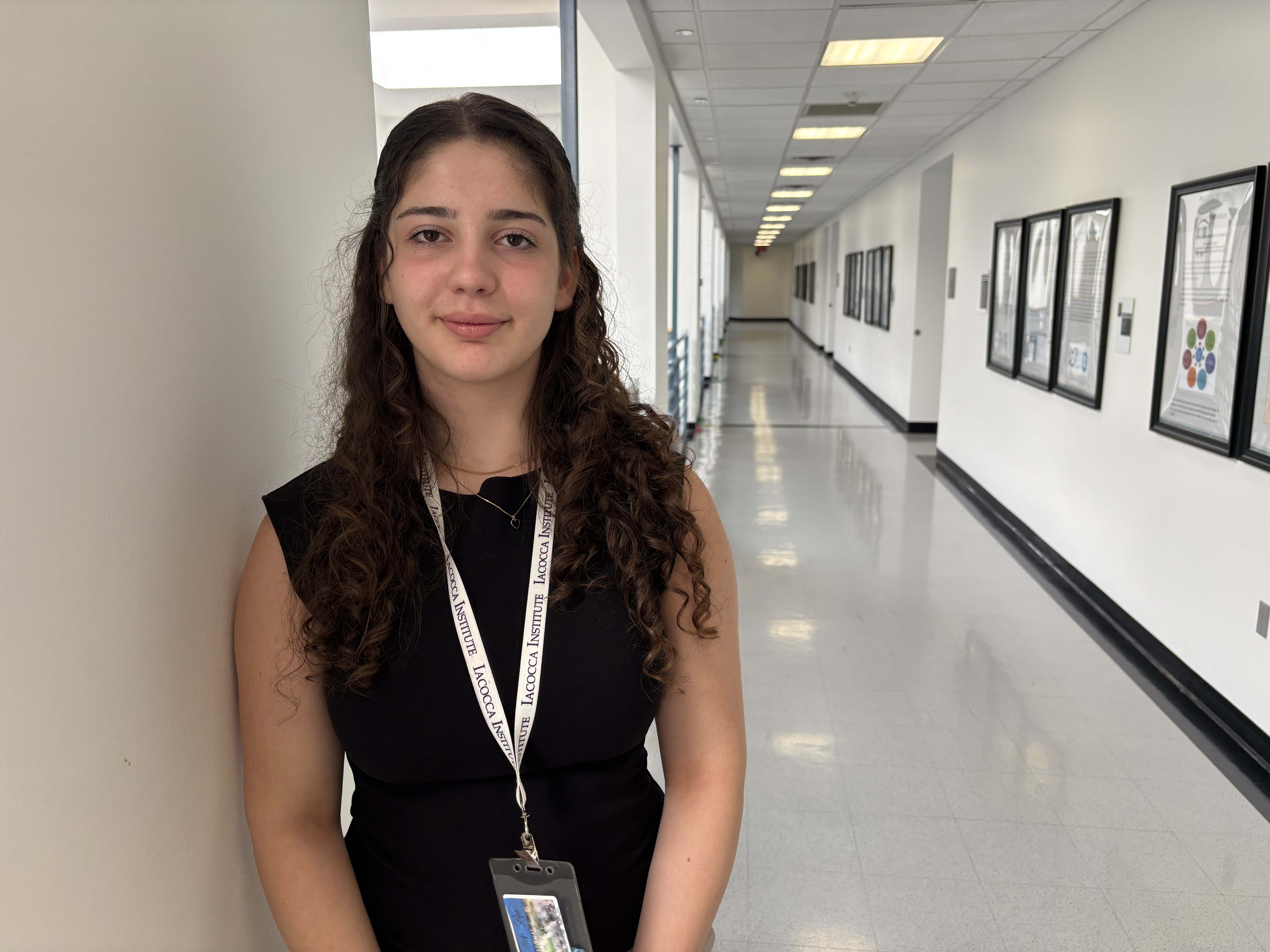 A young woman standing in a hallway