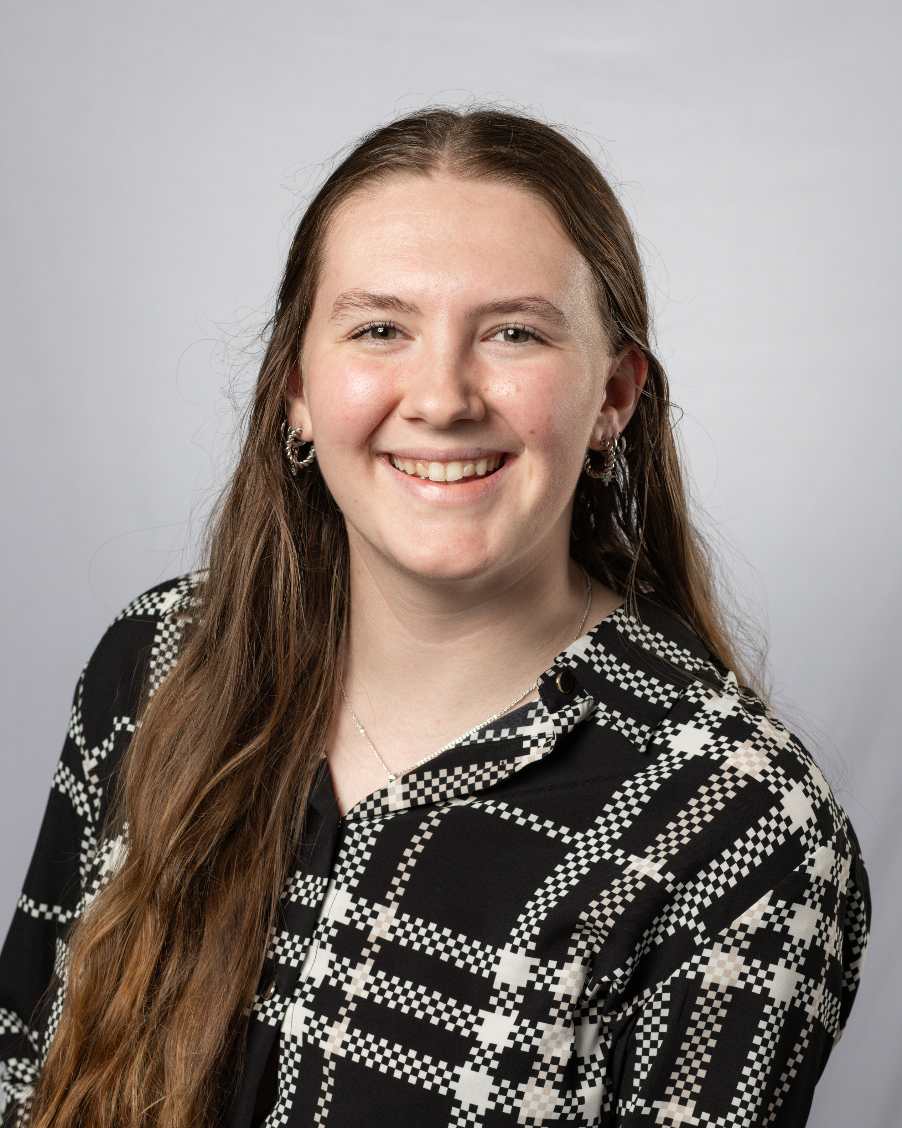 A headshot of a young woman