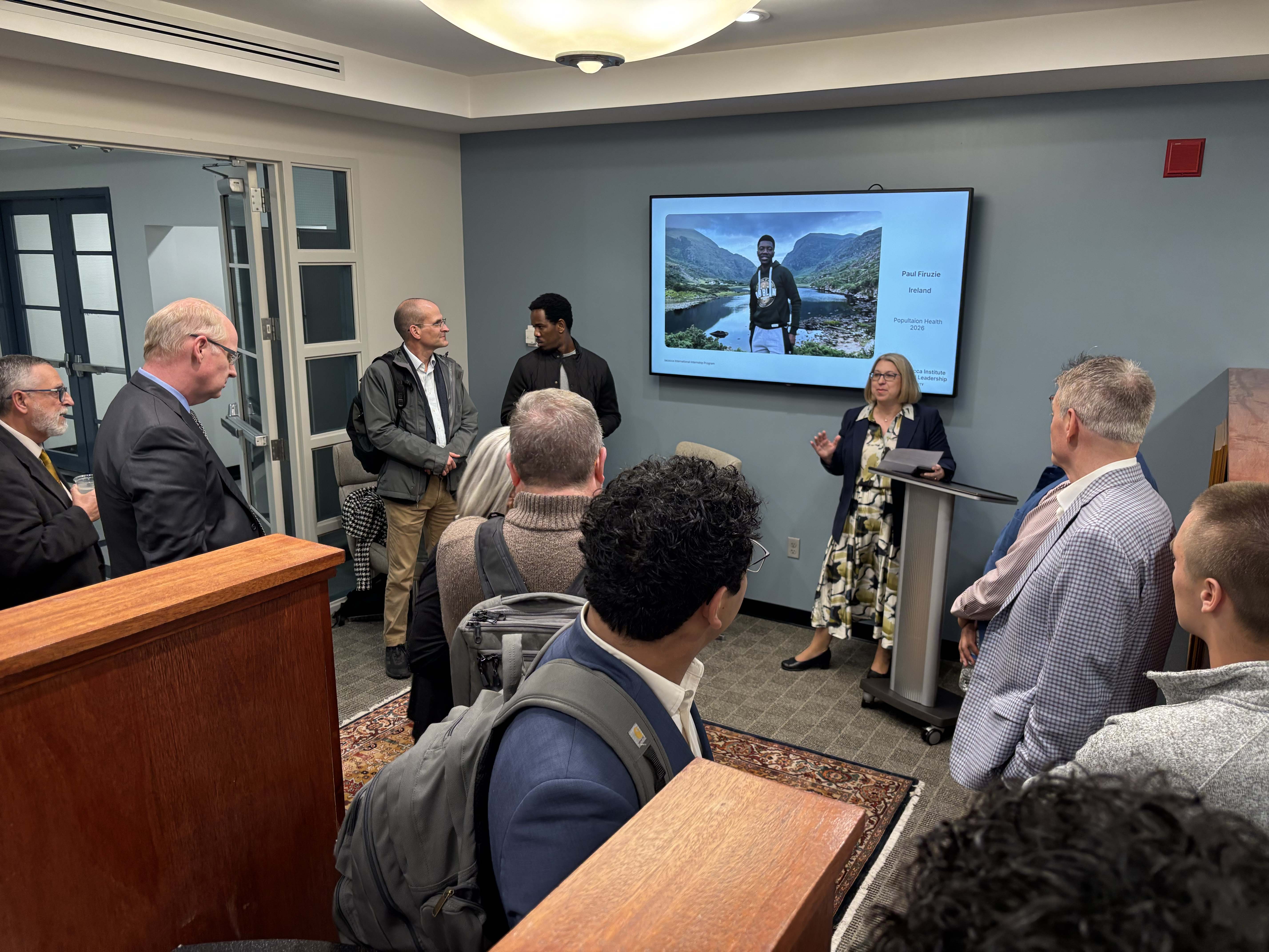 A group of people in an office setting for an open house