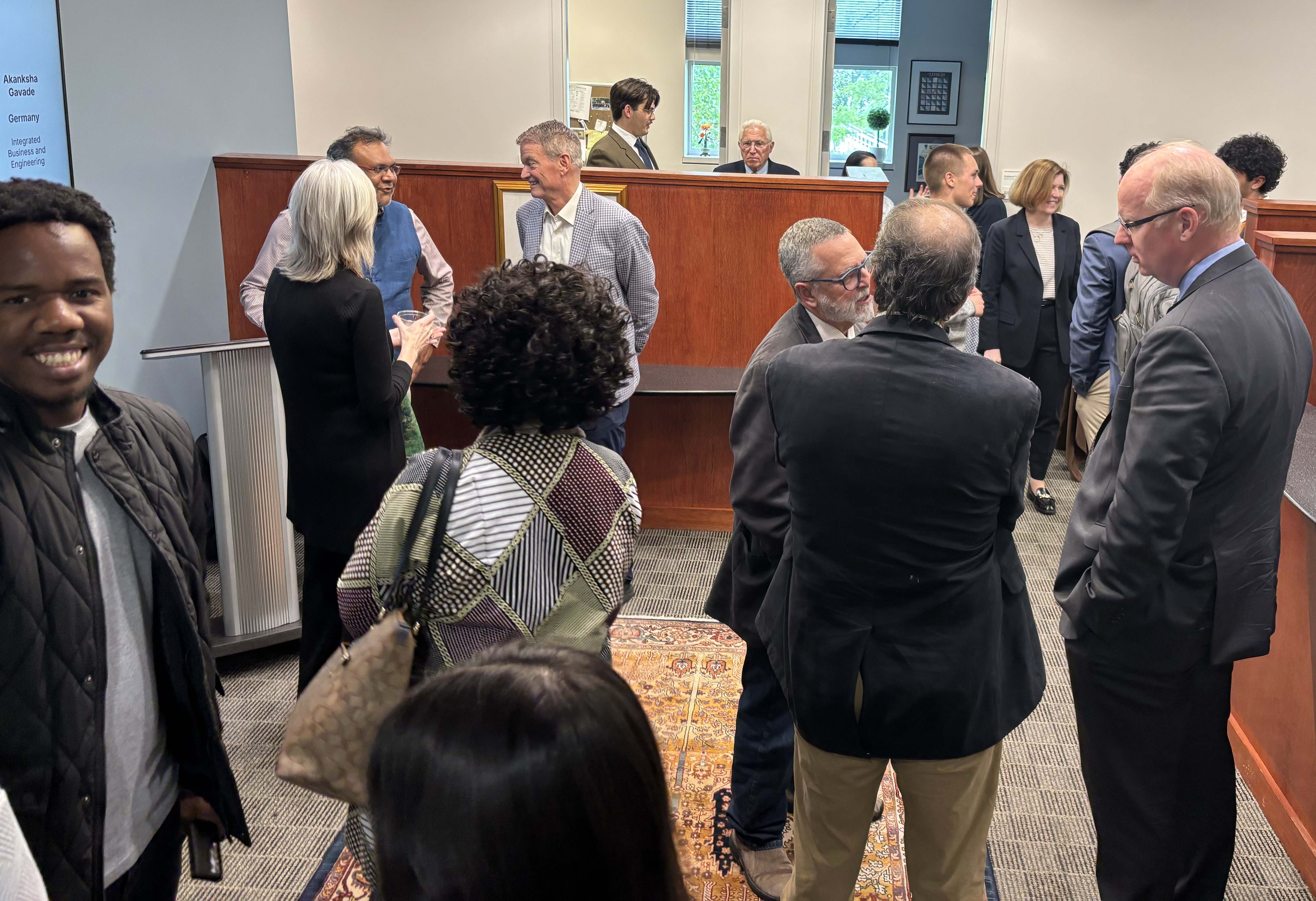 A group of people at an office space community open house