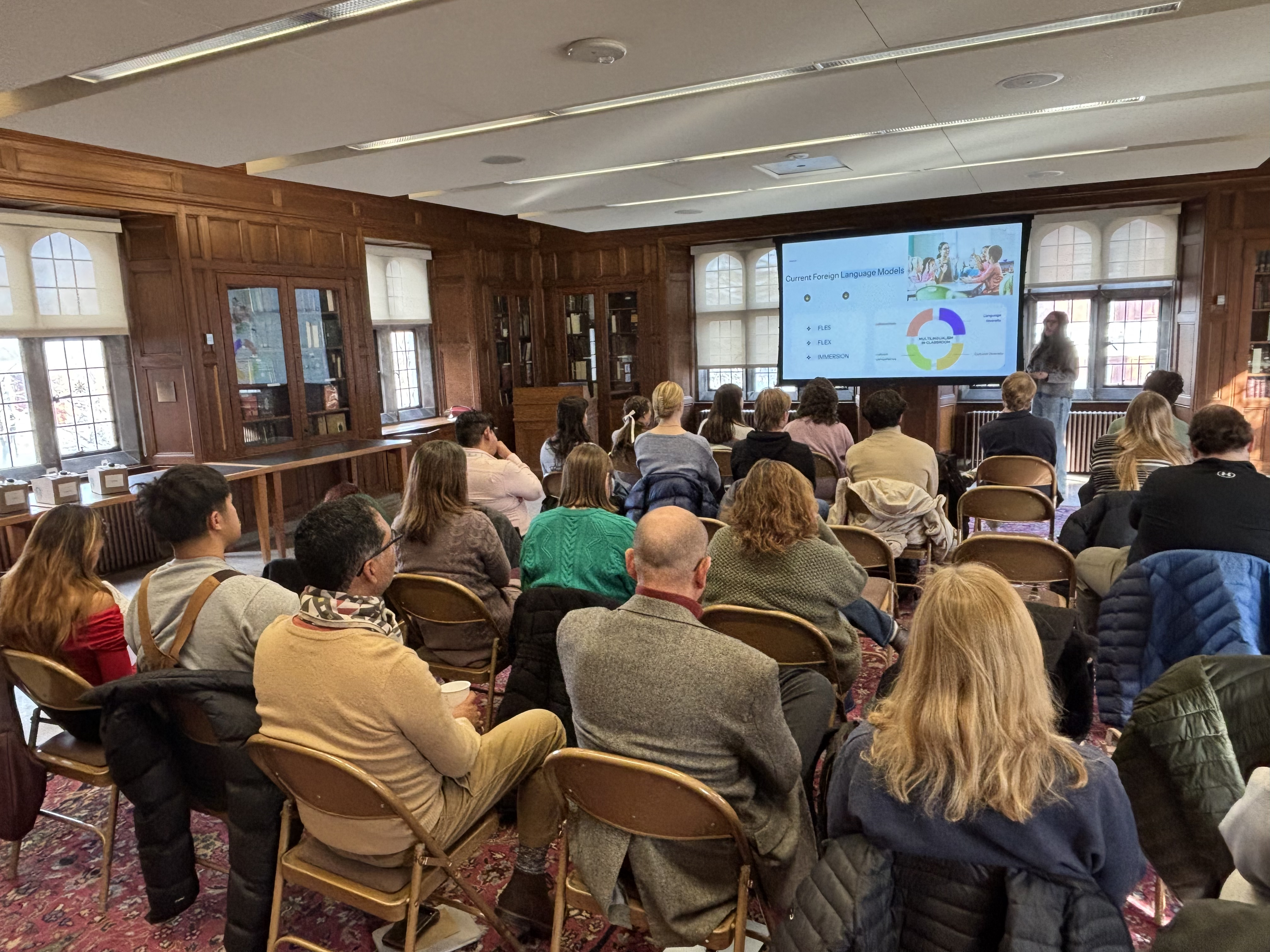 Several people listening to a presentation