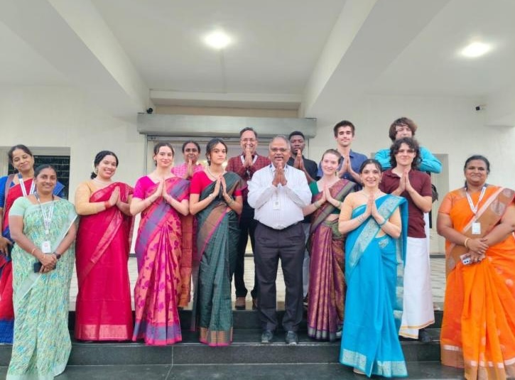 A group of students wearing traditional South Indian clothing