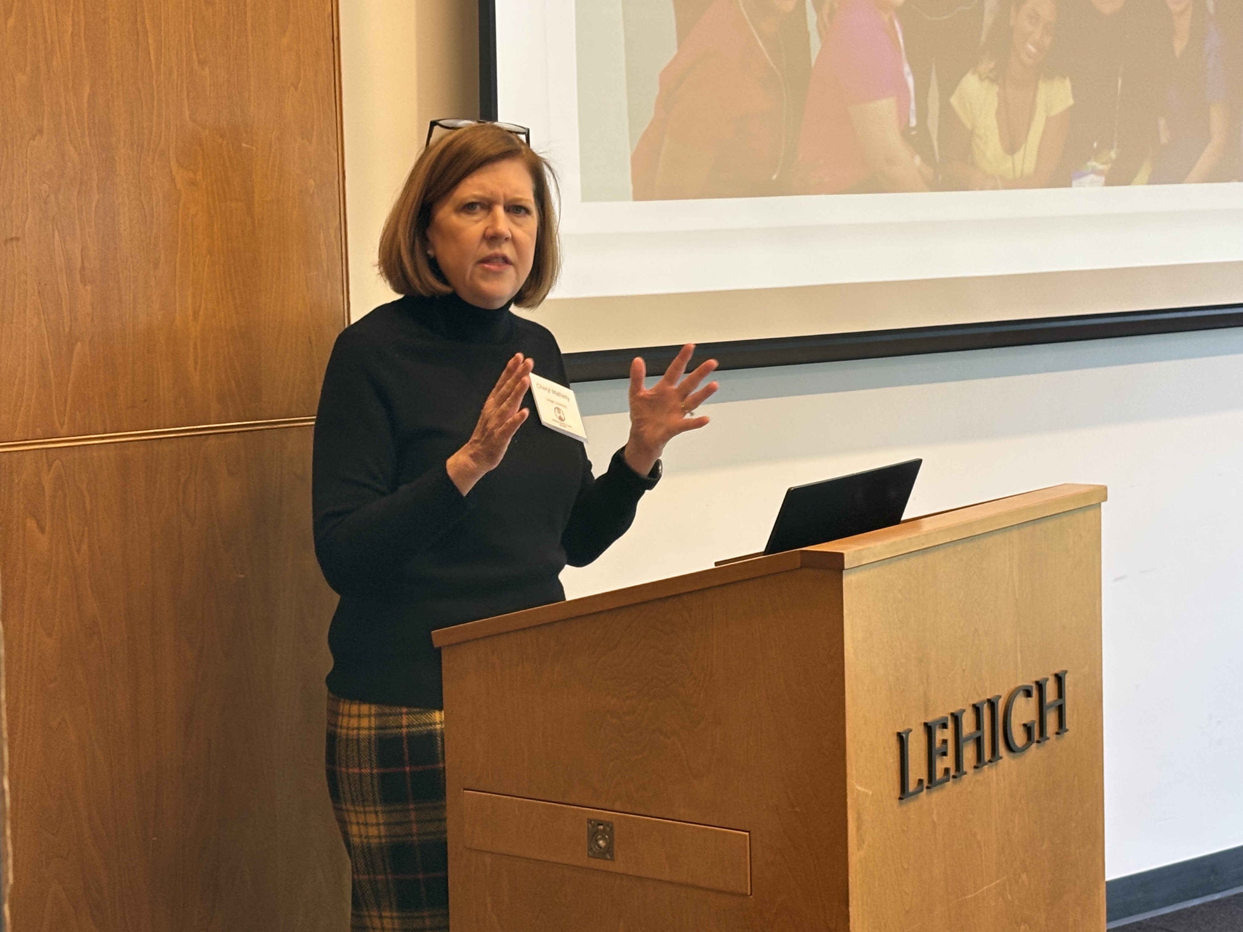 A woman standing at a podium and speaking