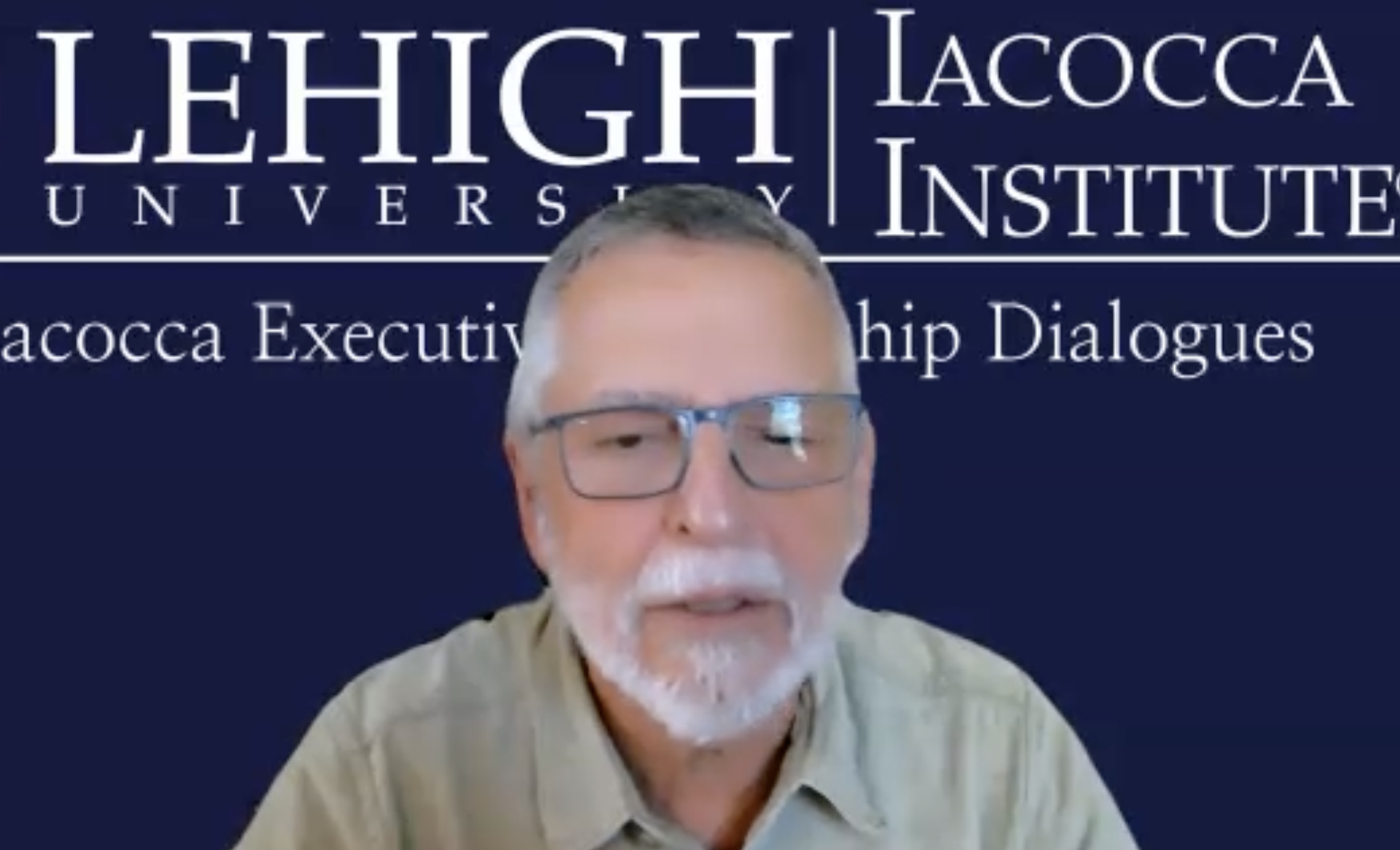 A screenshot of Roland Kushner presenting via Zoom