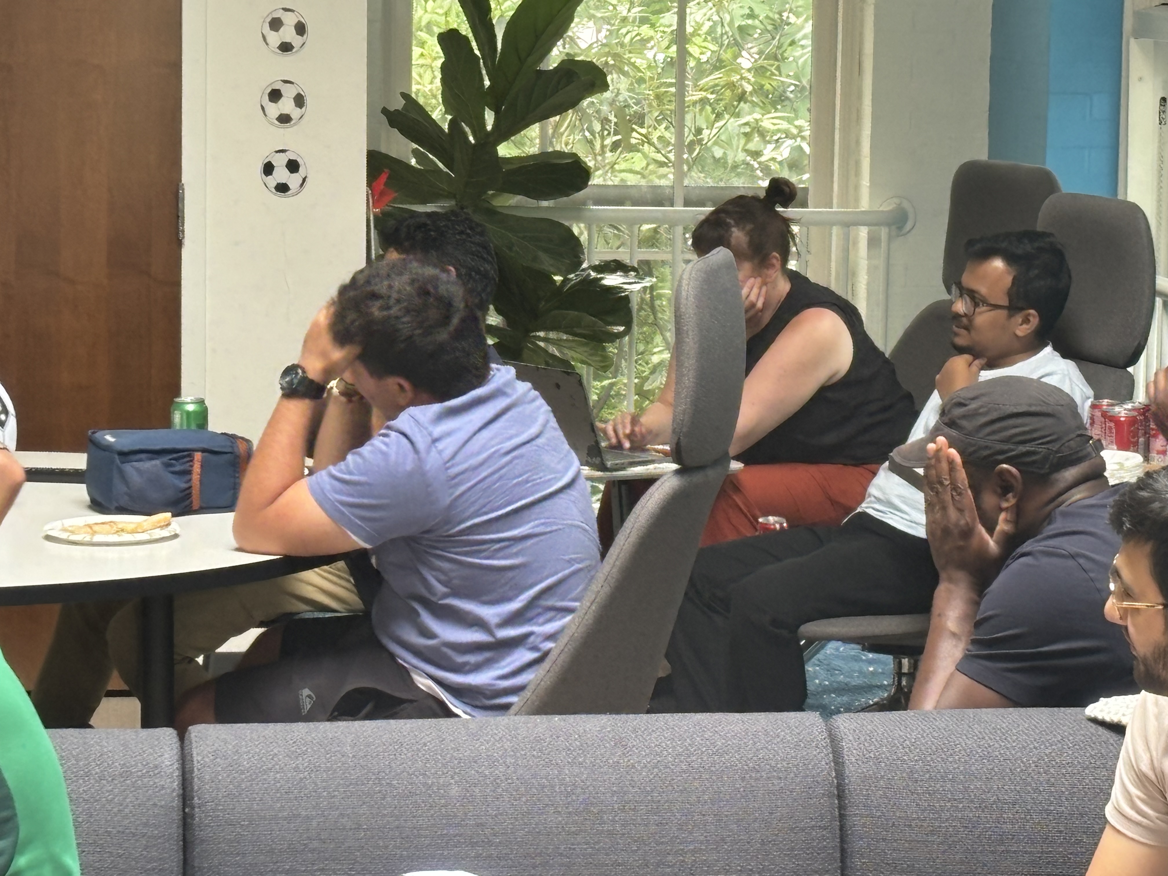 A group of people watching a World Cup match at a party