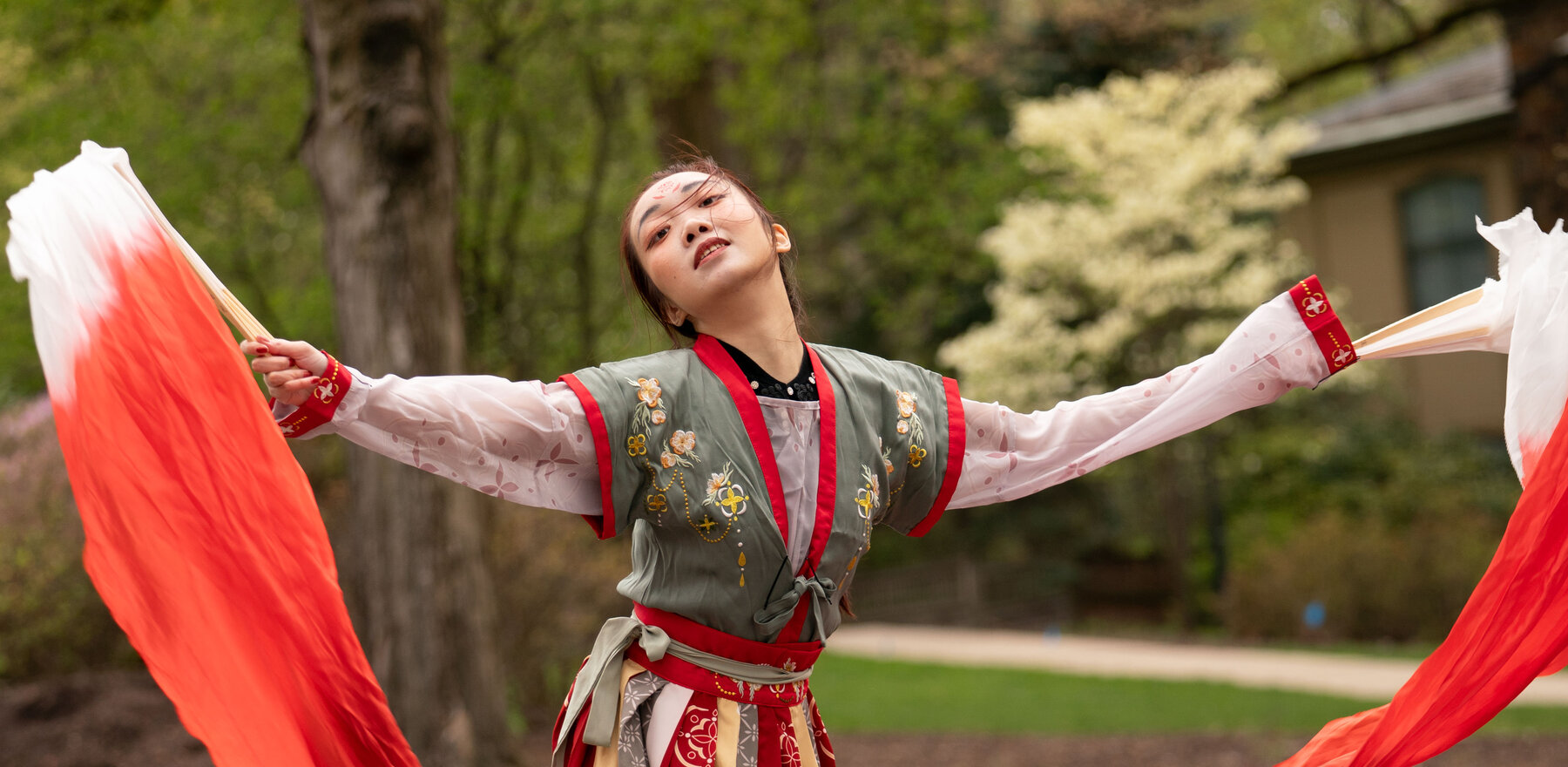 A young woman performing a dance at an international festival