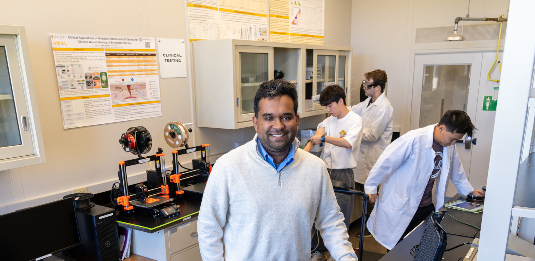 A man in a white lab coat in a laboratory