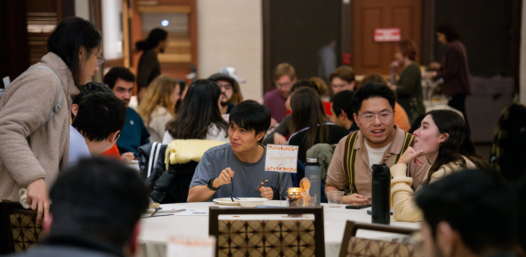 People eating in a hall