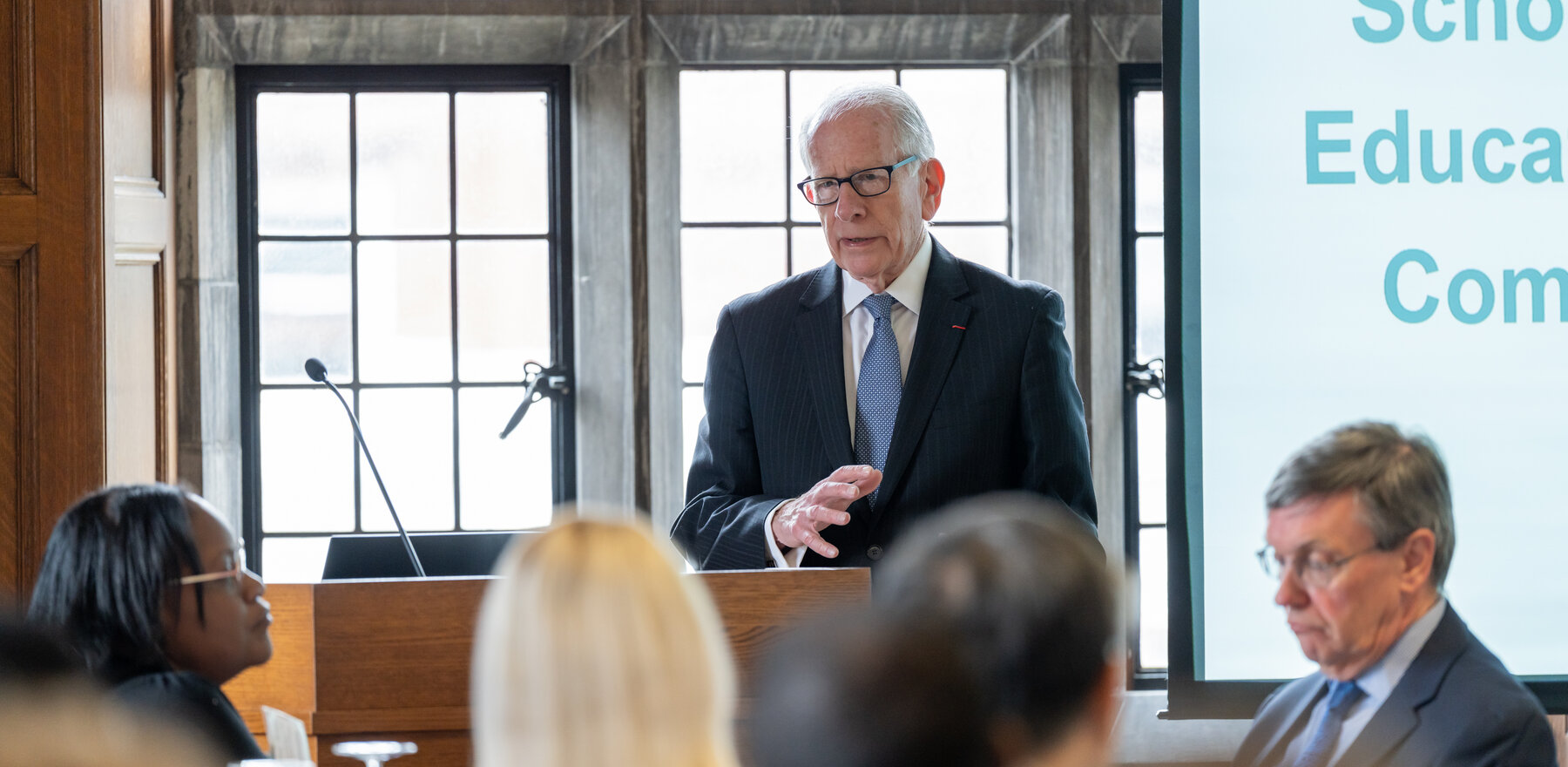 Allan Goodman speaking to an audience from a podium