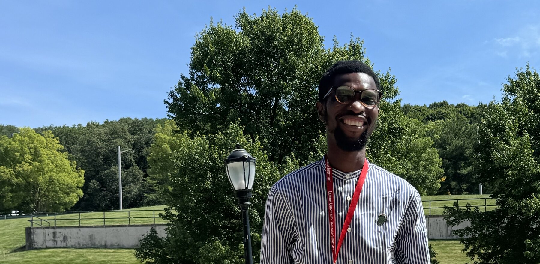 Amoo Ridwanullahi Olasunkanmi smiling while outside