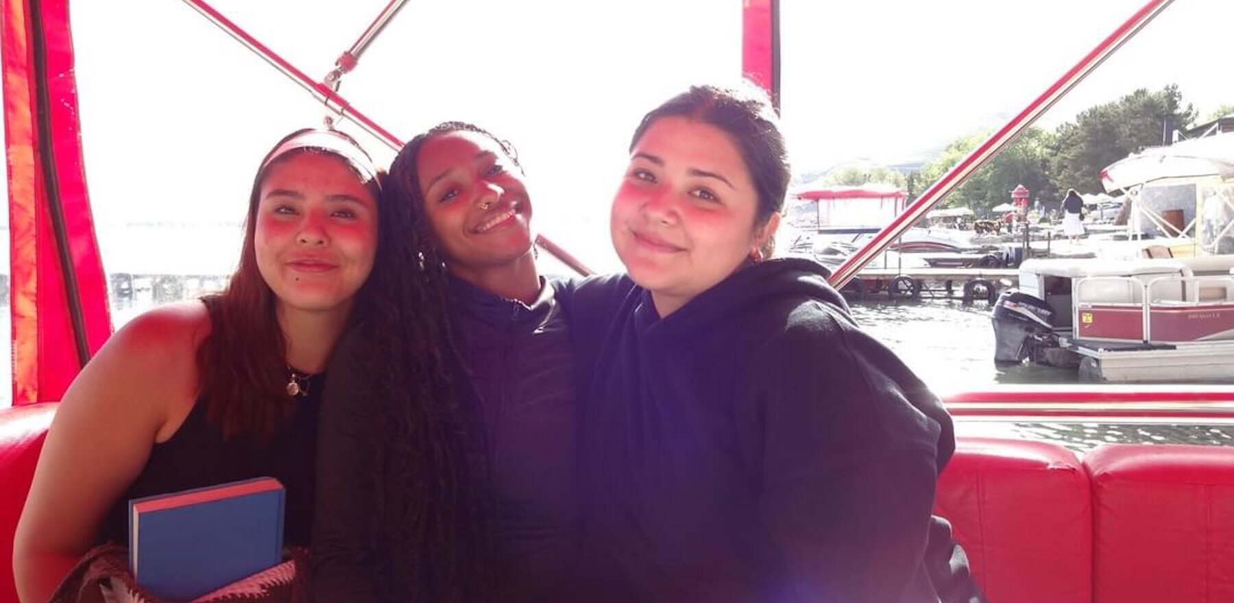Three young students posing for a photo