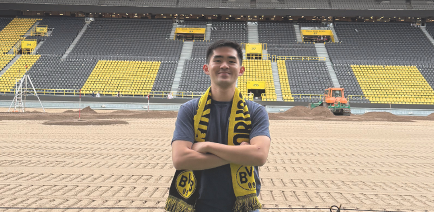 Anh Quan Nguyen standing in a football stadium in Dortmund, Germany