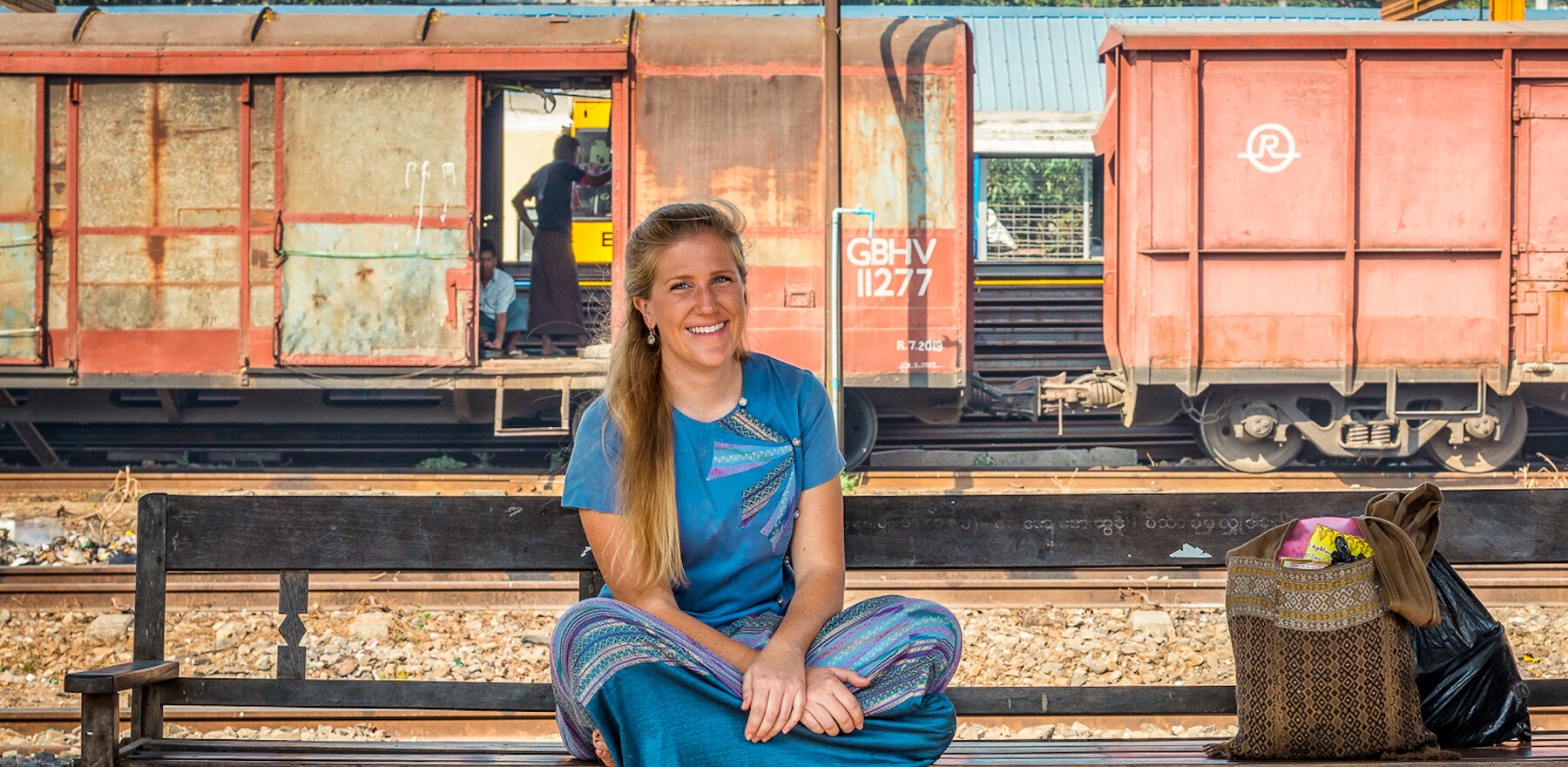 Ashley Pritchard sitting on a bench in Myanmar