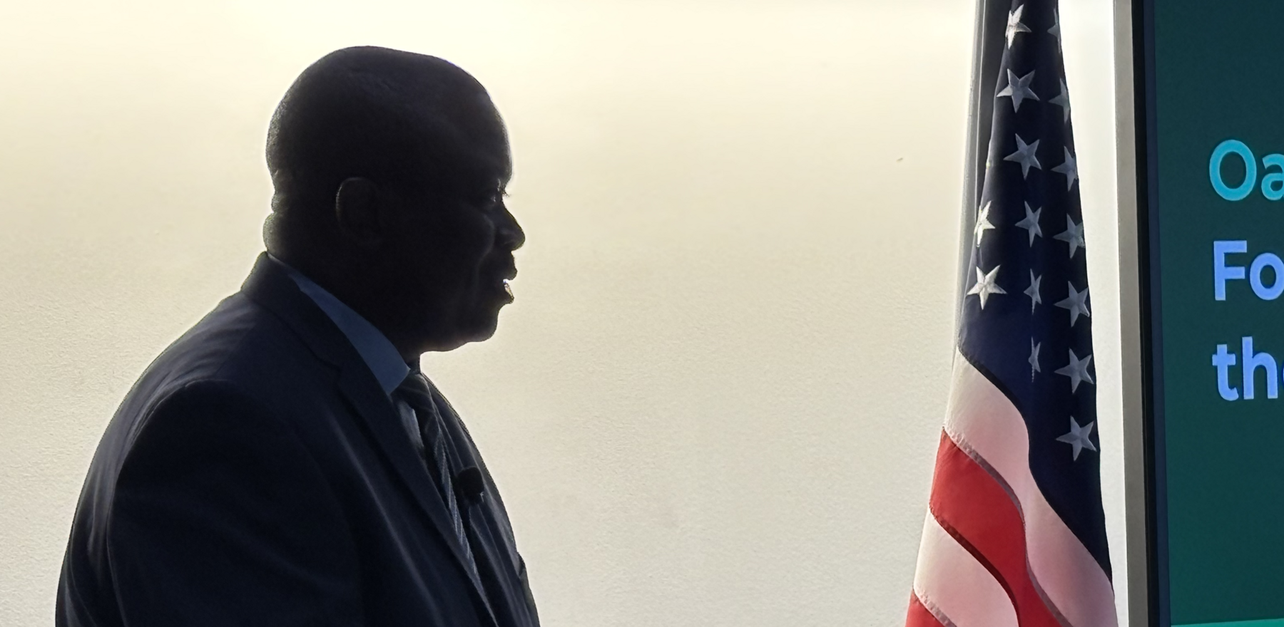 A man standing at a podium speaking