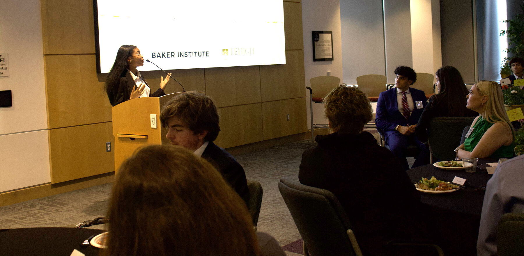 A student speaking at a podium at an event at Lehigh University