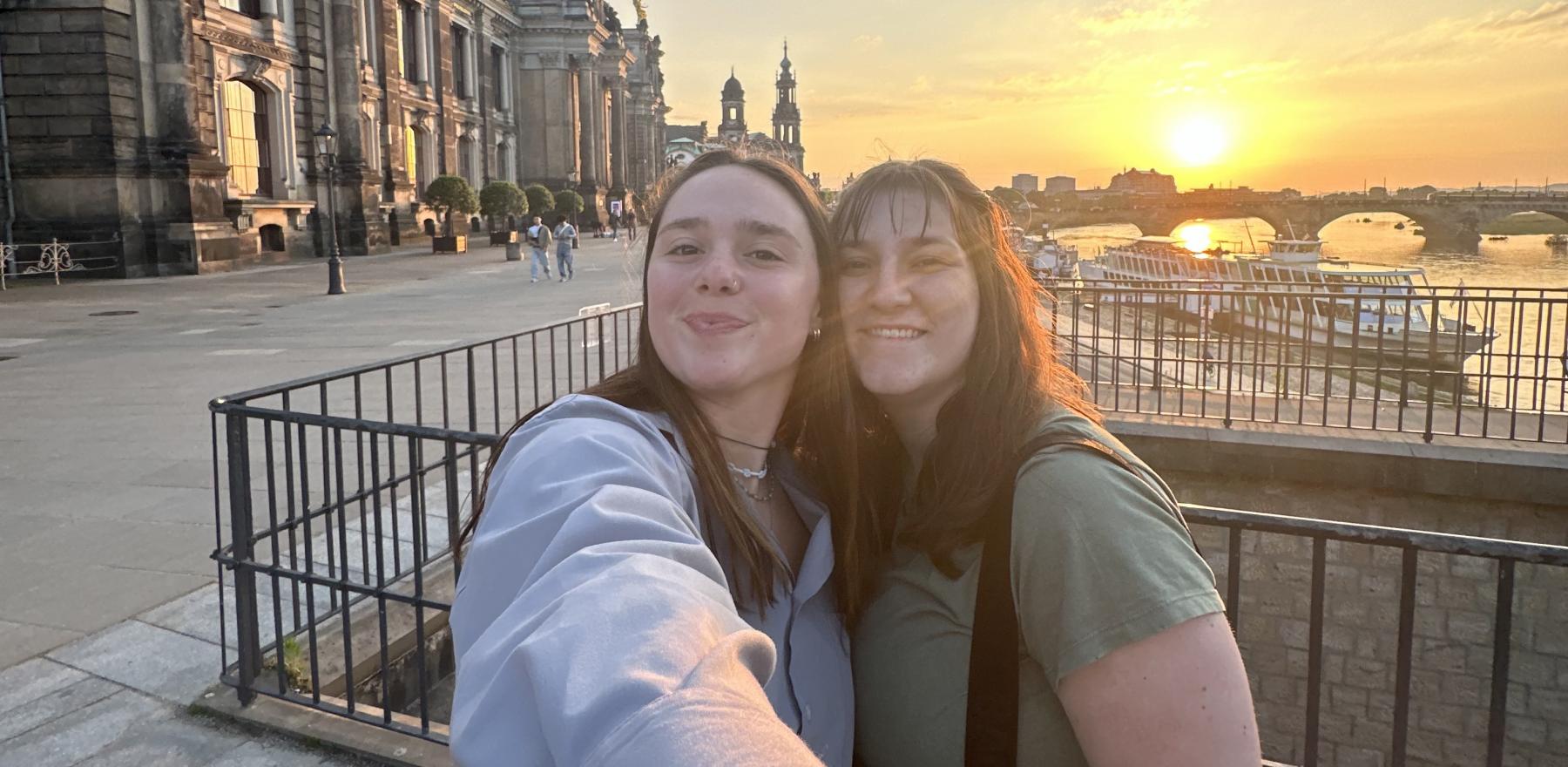 Two girls in TU Dresden posing for a selfie photo