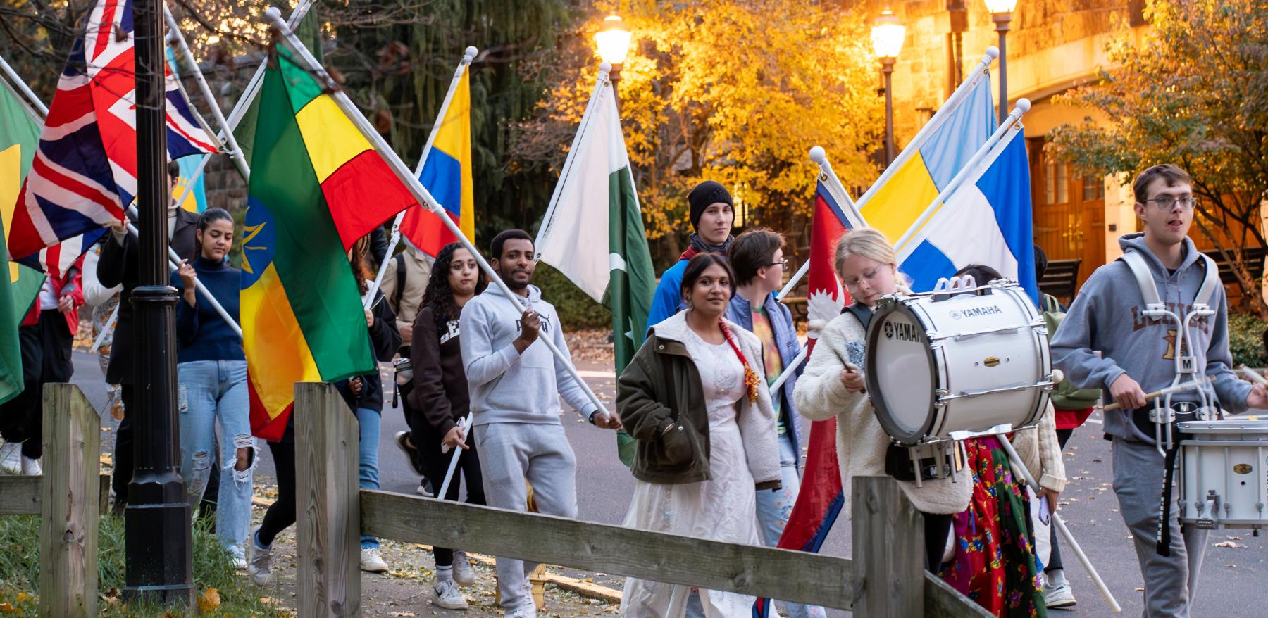 Students carrying flags during a parade at Lehigh University