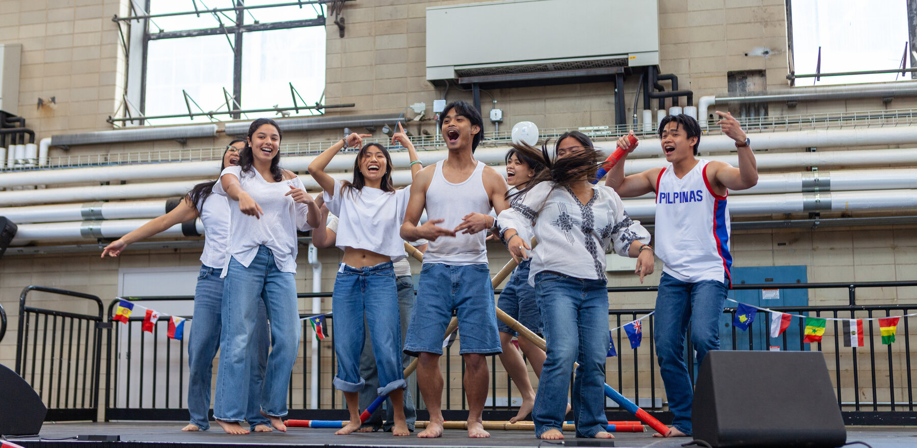A group of college students performing at an indoor event