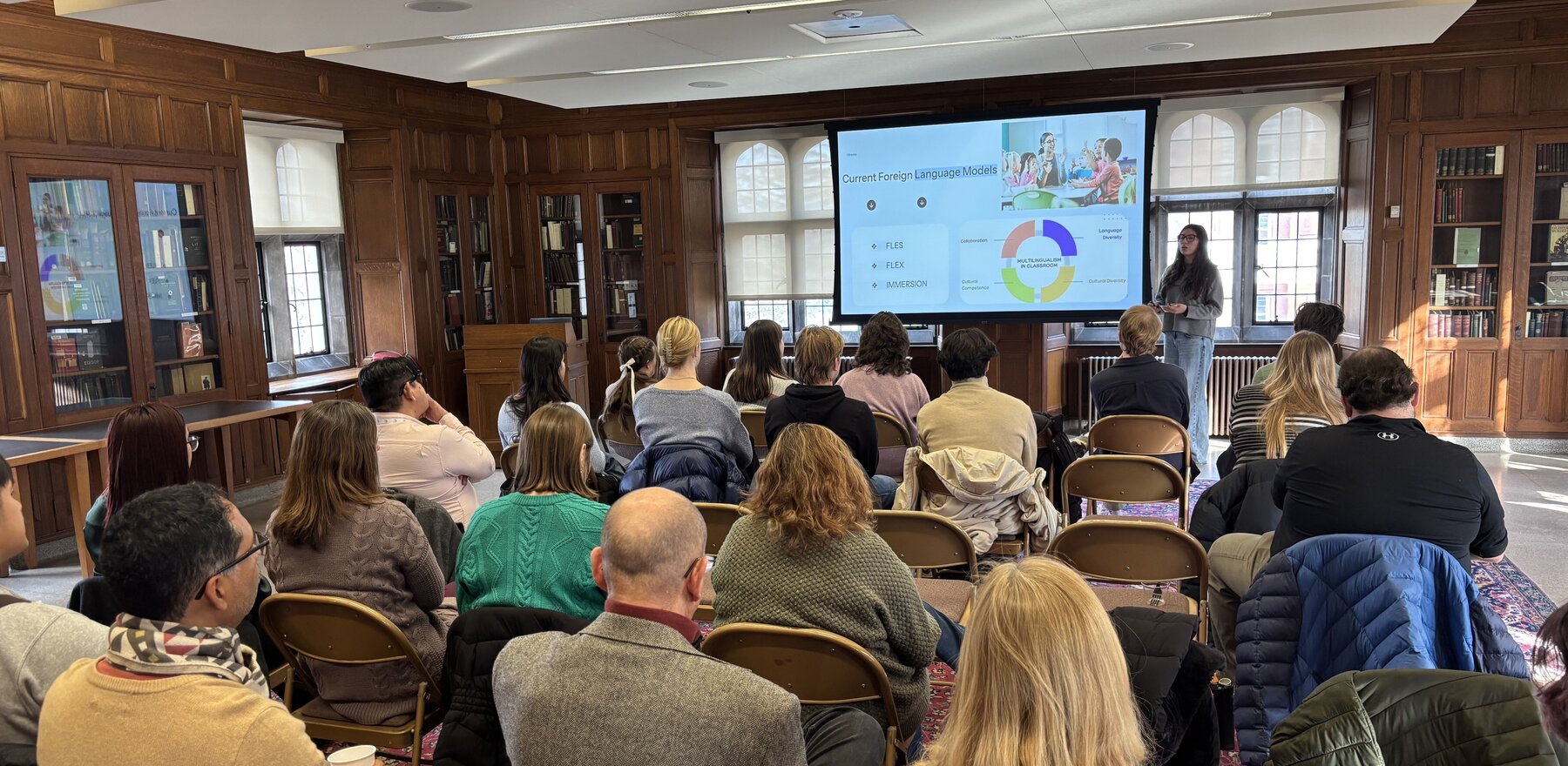 Several people listening to a presentation