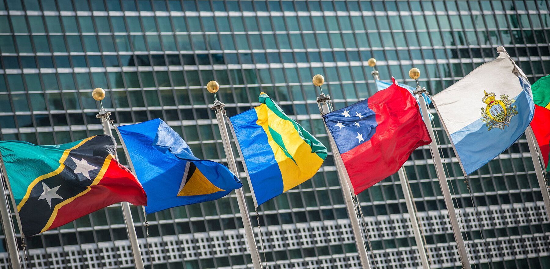 Several flags outside the United Nations headquarters building