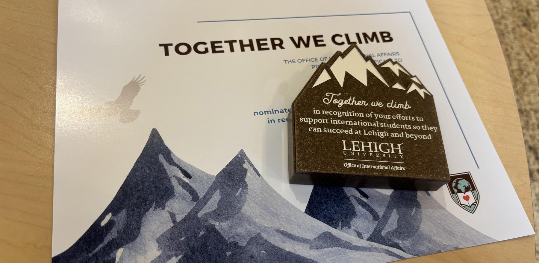 The certificate and trophy for Together We Climb