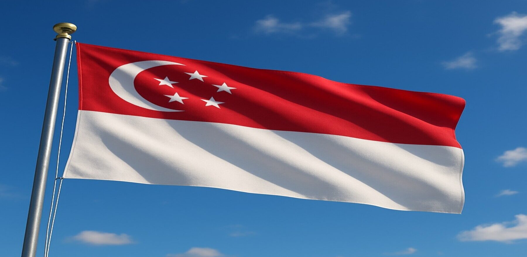 Singapore flag waving in blue sky