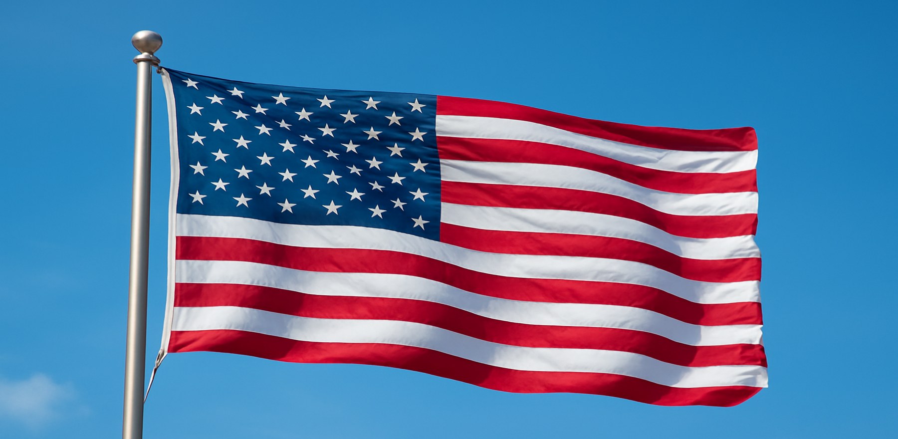 US flag with blue sky background