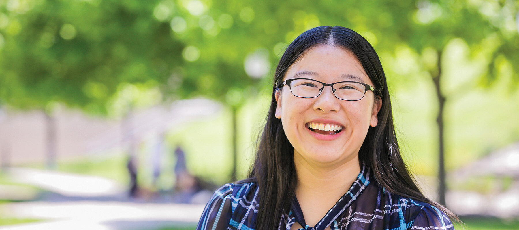 Jenny Lin smiling outside Rauch Business Center at Lehigh University