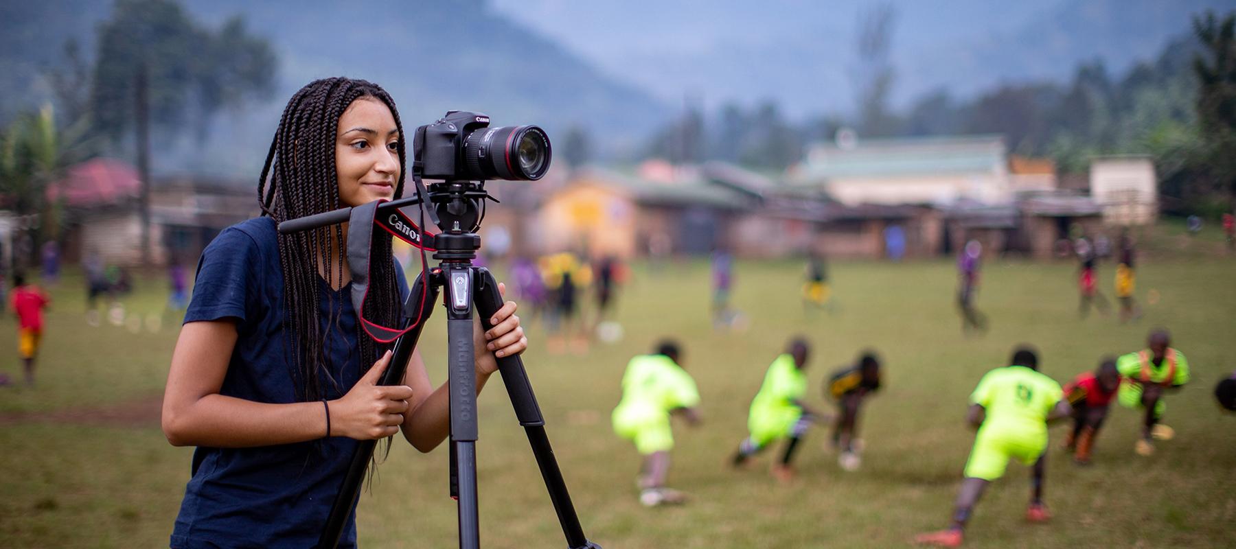 Student filming in Uganda