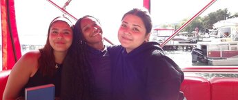 Three young students posing for a photo