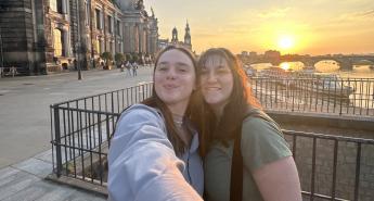 Two girls in TU Dresden posing for a selfie photo