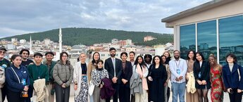 A large group assembled outside for a picture in Istanbul