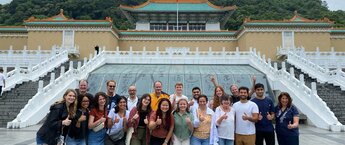 A group of people in front of a museum in Taiwan