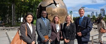 Five people at the United Nations headquarters in New York City