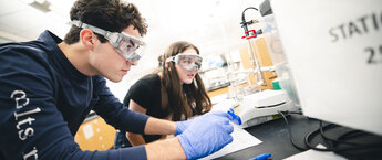 Two young people working in a laboratory