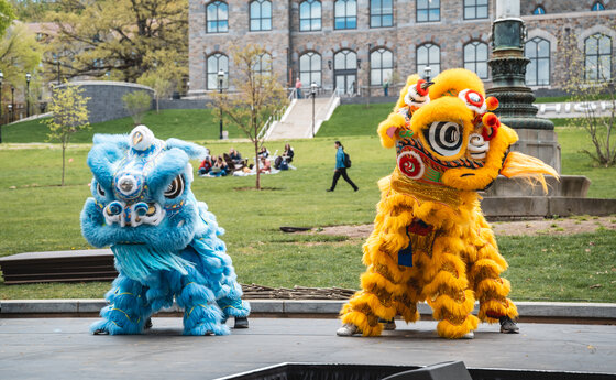 Two dragon costumes at a dance performance