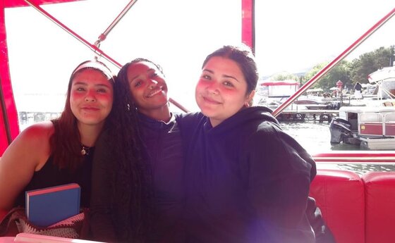 Three young students posing for a photo