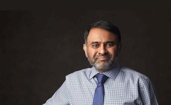 Anand Ramamurthi in a shirt and tie